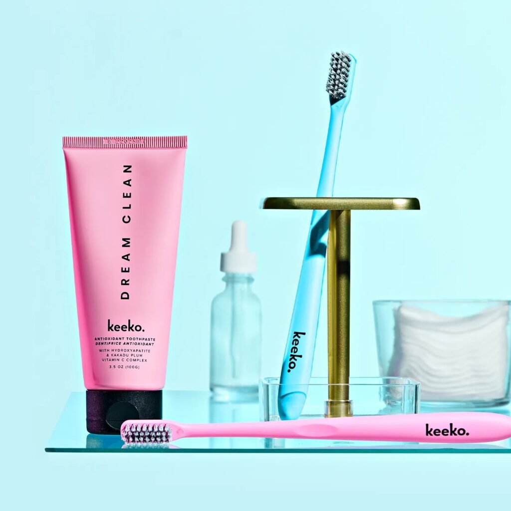 keeko toothpaste on shelf with toothbrush and serum