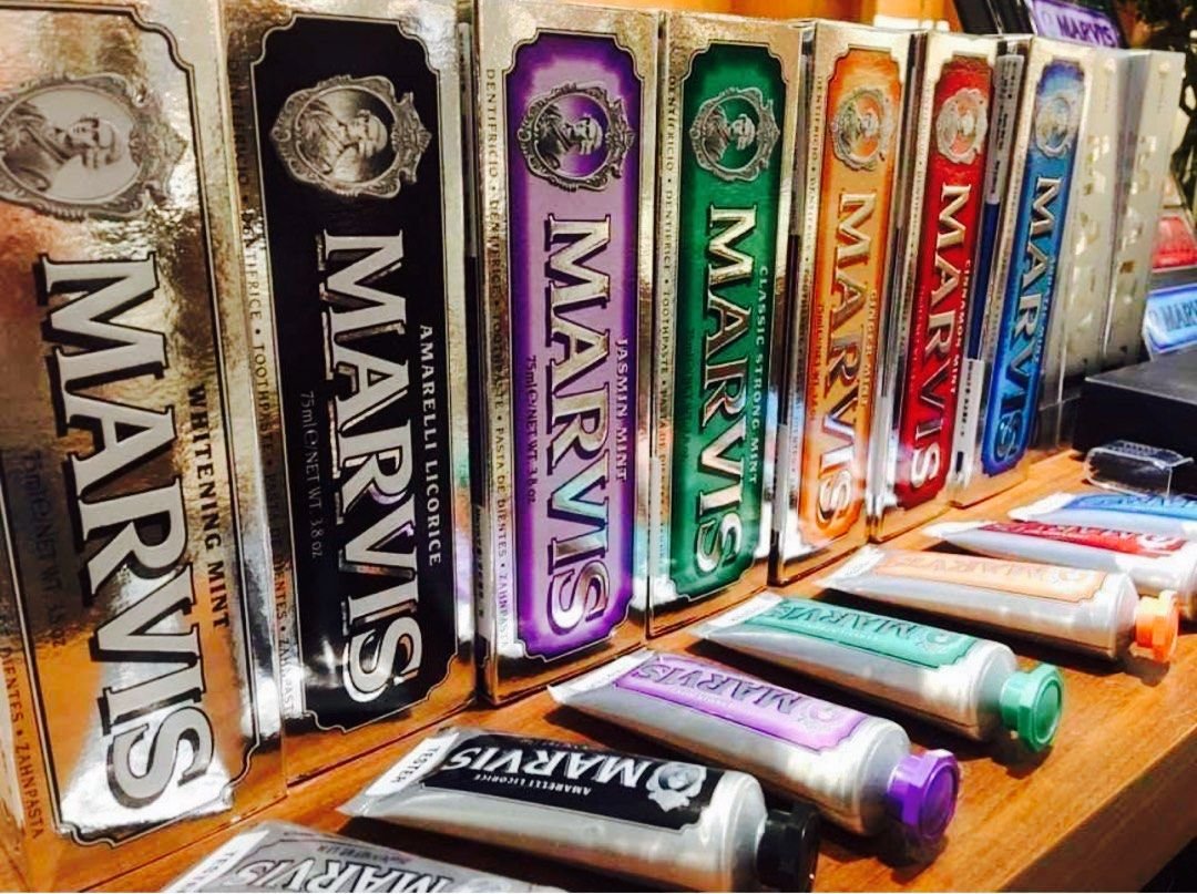Different falvours of marvis toothpastes organized in a line