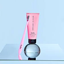 keeko toothpaste and toothbrush on a glass table