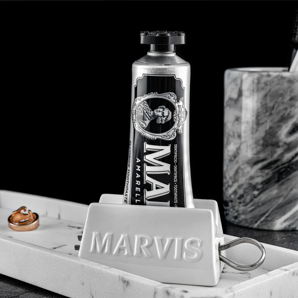 A lifestyle shot of Marvis Classic Strong Mint on a marble bathroom vanity.
