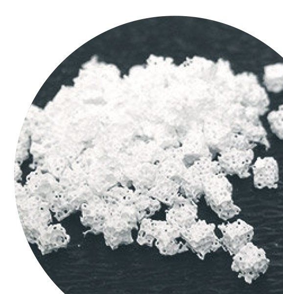 Close-up of white hydroxyapatite mineral powder used as a non-toxic, peroxide-free alternative for strengthening tooth enamel.