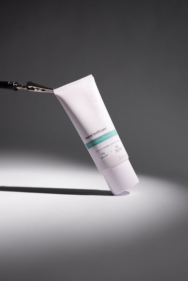 nura toothpaste tube in the spotlight