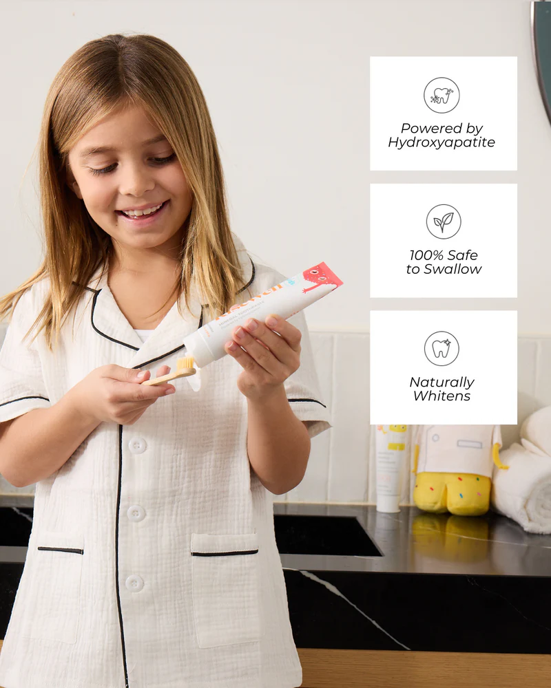happy girl using risewell kids toothpaste