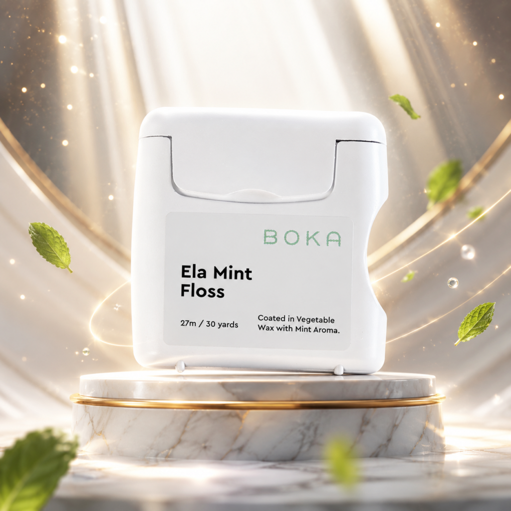 Boka dental floss displayed as the best dental floss of 2026 on a luxury pedestal with mint leaves and golden light