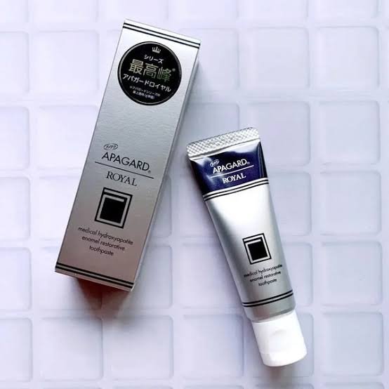 Apagard Premio hydroxyapatite toothpaste premium Japanese remineralizing toothpaste tube and box displayed in an elegant luxury setting