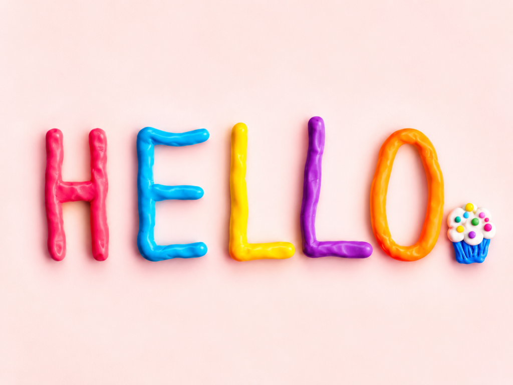 Colorful handmade clay letters spelling HELLO with a playful dental-inspired decoration representing Hello oral care.