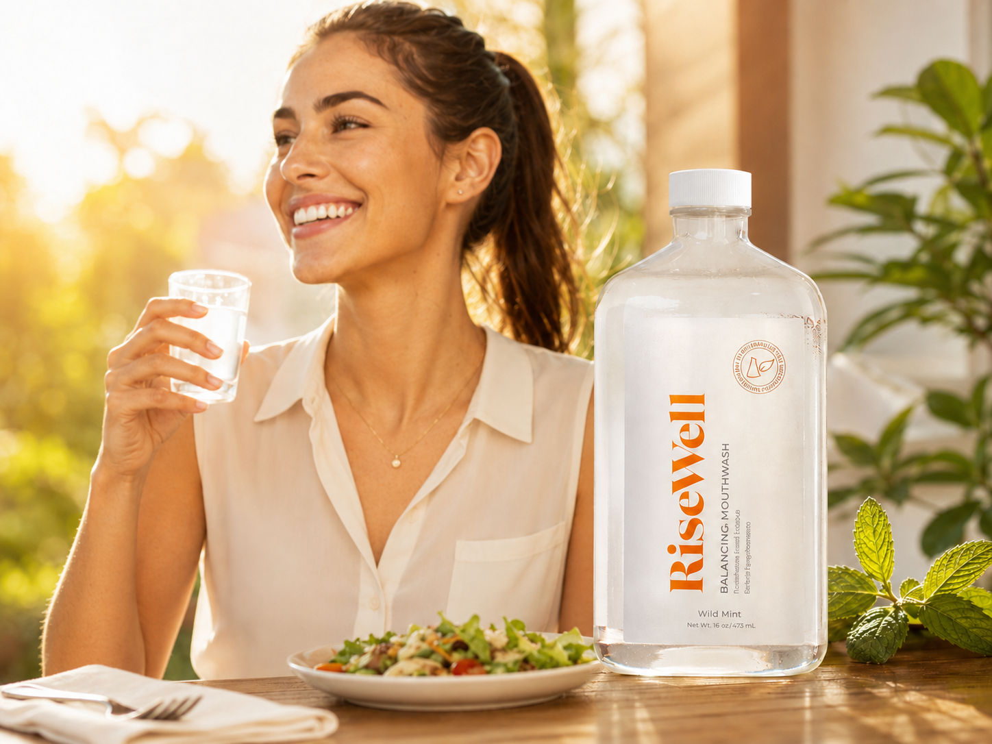Risewell Balancing Mouthwash displayed during a sunny lunch with a smiling woman in classic daytime clothing.